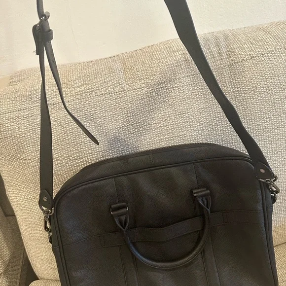 Black Leather Briefcase with Pebbled Texture and Structured Design